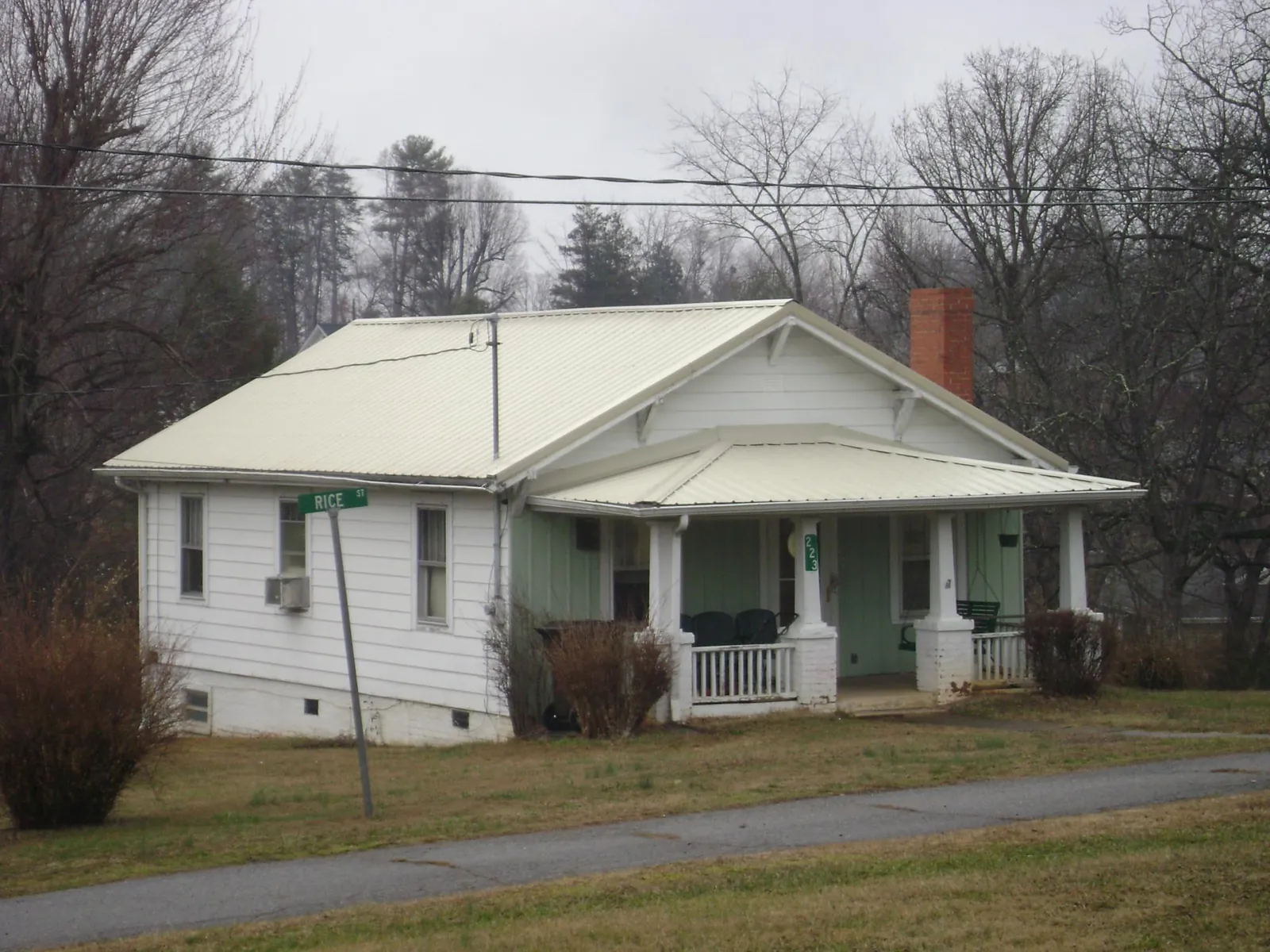 White metal roof on a craftsman bungalow at a street corner in Lancaster
